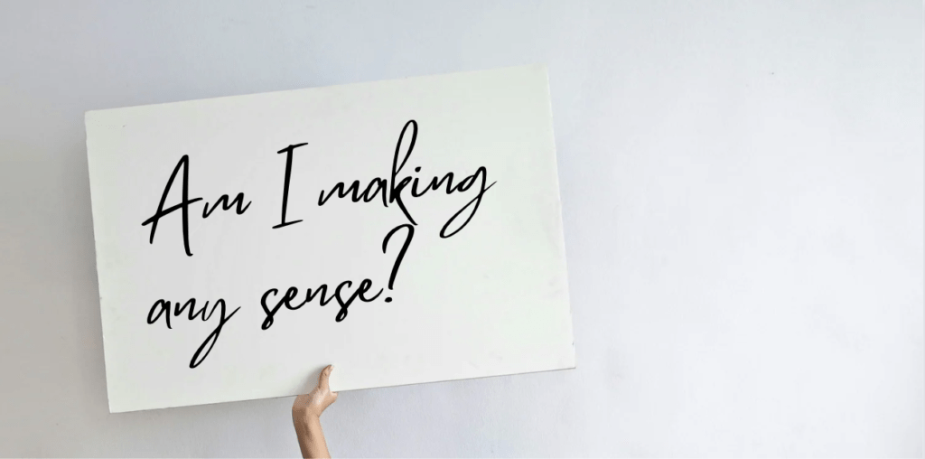 A placard reads "Am I making any sense?"